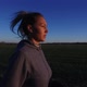 Slow Motion: Female Runner Across Countryside Fields On Sunny Morning - VideoHive Item for Sale