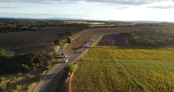 Aerial  Panoramic Shot of Cars Driving Near Valensole France Close to Sunset