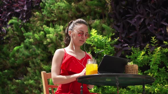 Young Caucasian Woman Using Video Chat on Tablet for Remote Working From Sunny Mediterranean Country alt