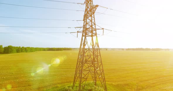 Vertical Movement Flight Near High Voltage Electricity Tower and Power Lines at Green and Yellow alt