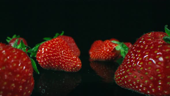 Isolated Strawberries On Dark Surface alt
