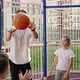 School Coach Mentoring Kids How to Catch and Throw the Ball on Basketball Court Outdoor - VideoHive Item for Sale