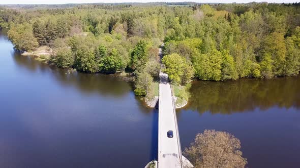 Two Passenger Cars Driving on a Bridge Drone Footage
