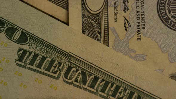 Rotating footage shot of American paper currency on an American eagle shield background alt