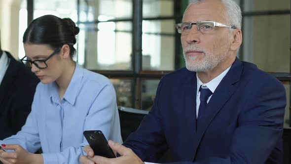 Elderly Man Reading Good Message About Job Hiring, Concept of Aging Workforce alt