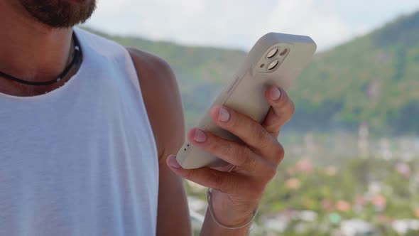 Details Hands of a Bearded Man Internet User Using Smartphone Checking Content in Social Media alt