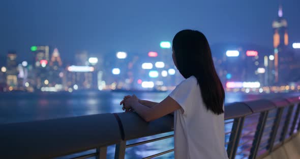 Woman look at the city view in evening