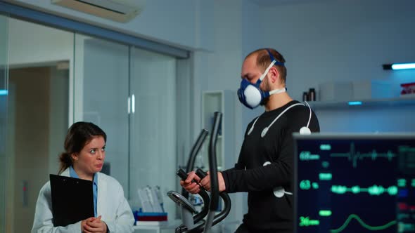 Medical Doctors in Sports Science Lab Measuring Performance Cardiorespiratory alt