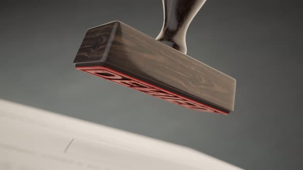 An important document being denied by red office stamp in slow motion. 4KHD alt