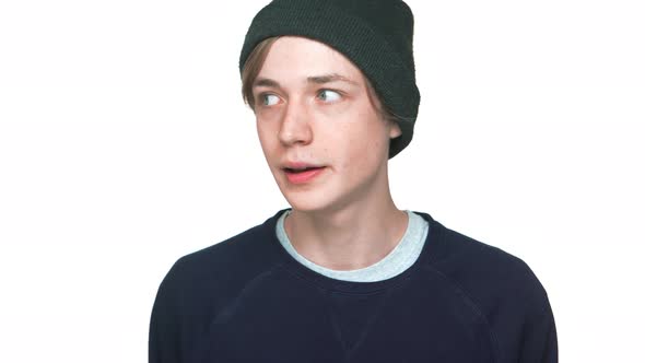 Portrait of Blueeyed Nervous Teen Guy Wearing Sweatshirt and Hat Want to Say Truth Hinting at alt