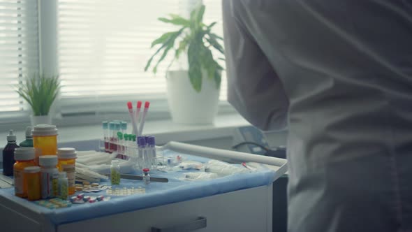 Doctor Vaccinating Clinic Client in Office Close Up alt