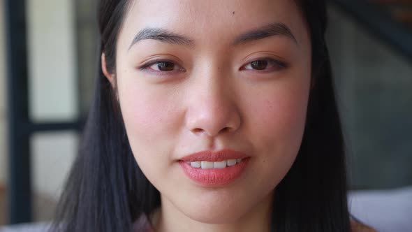 Closeup Headshot Portrait of Charming Young Asian Ethnicity Woman Smiling with Toothy Smile Looking alt