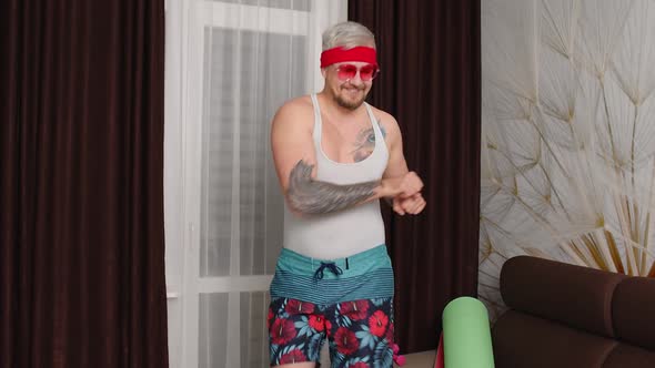 Sportsman Retro Guy in Funny Clothes Dancing at Home Man Making Sport Fitness Cardio Exercises alt