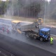 The final stage of road works. Laying the top layer of hot gray tarmac mix - VideoHive Item for Sale