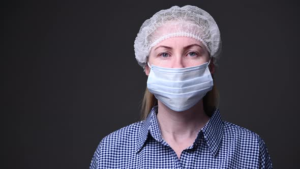 A Girl in a Medical Mask Protects Herself From the Covid-19 Virus. Quarantine, Stay Home. Viral alt