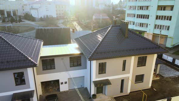 Aerial View of Private House with Ceramic Shingles Covered Roof Top alt