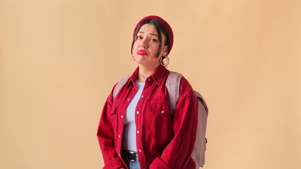 Young stylish woman tourist student frustrated unhappy and sad crosses her arms on her chest. alt