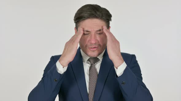 Middle Aged Businessman having Headache, White Background alt