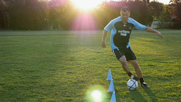 Soccer (Football) Player Dribble Through Cones