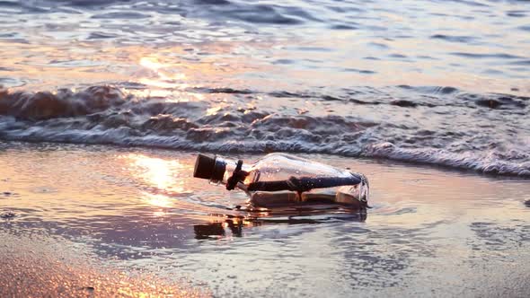 Message in the Bottle Against the Sun Setting Down alt