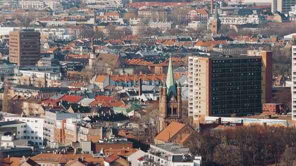 City centre  of the Norwegian capital, Oslo. Oslo Domkirke between the roof tops.4k telephoto pan. alt