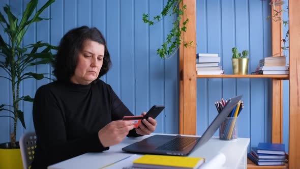 Elderly Woman Using Credit Card for Online Shopping alt