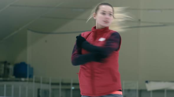 Caucasian woman on skate whirling on ice