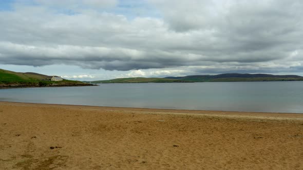 Still time lapse of isolated house by Scottish loch alt