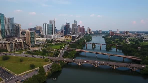 AERIAL: Pulling back from downtown Austin, Texas on a beautiful sunny day. alt