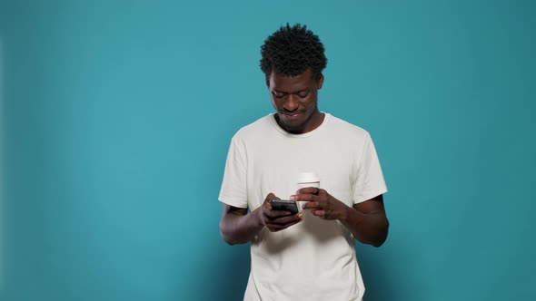 Portrait of Modern Person Looking at Display on Smartphone alt