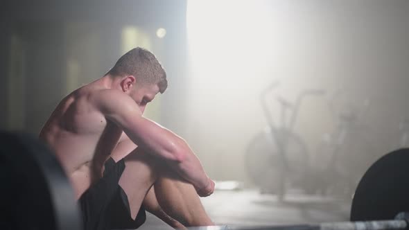Exhausted Young Men Resting After Intensive Workout in Gym alt