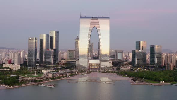 CBD buildings by the lake. Aerial in Suzhou, China. alt