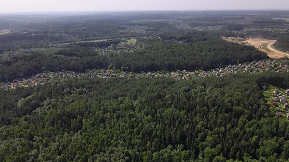 Bird'seye View of a Residential Village in the Middle of the Forest alt
