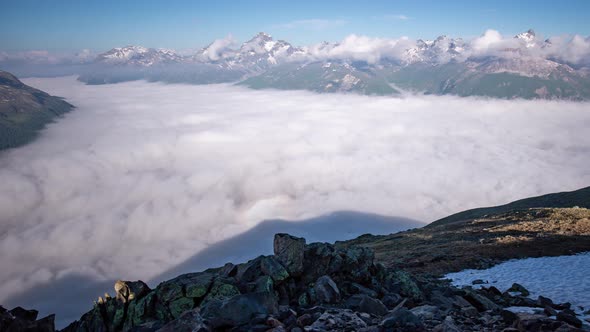 timelapse of a dynamic layer of morning fog moving in Oberengadin valley seen from Segantini Hut abo alt