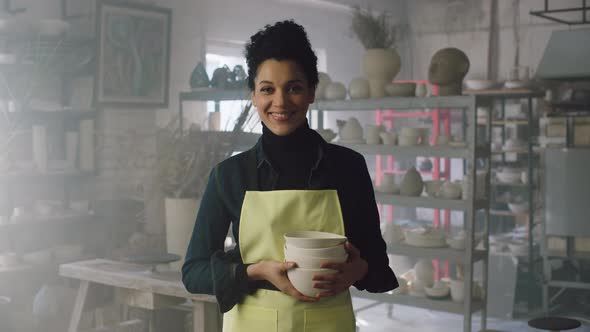 Portrait of Woman Potter In Yellow Apron alt