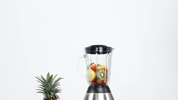 Various fruits and vegetables in blender alt