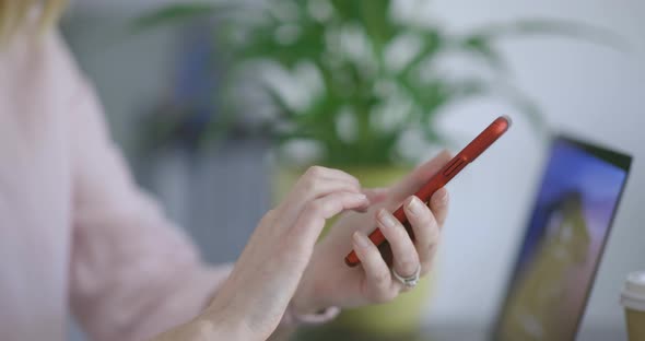 Hands of woman text messaging on smartphone alt