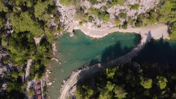 Beautiful Small Lake Among Rocks and Coniferous Trees alt