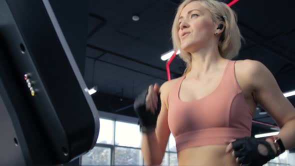 Young woman training on treadmill