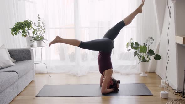 Woman exercising in living room alt