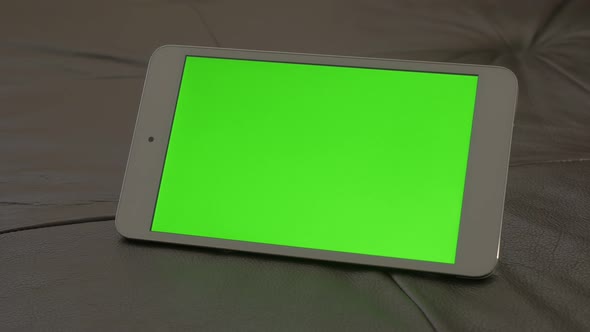 Modern PC tablet computer green screen display panning 4K 2160p 30fps UltraHD footage - Close-up of  alt