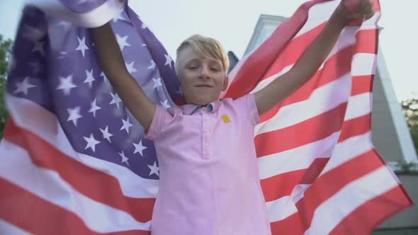 American Young Boy Waving USA Flag, Celebrating Independence Day, 4th of July