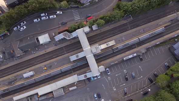 Trains Stopping at a Station in the UK Aerial View alt