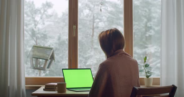 Relaxed Woman Working on Computer at Home By Wooden Window Slow Motion