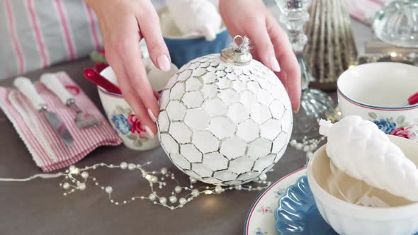 Christmas Table Decoration. Festive Table Setting. Female Hands Decorate the Table for Christmas alt