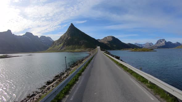 Driving a Car on a Road in Norway Lofoten alt