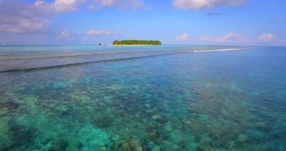 Aerial drone view of a scenic tropical island in the Maldives alt