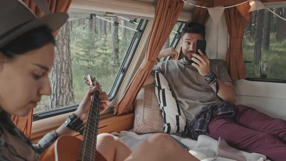 Couple in Camp Parked in Forest alt