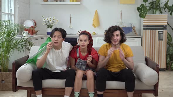 Happy Italian Fans Watch Sports on TV at Home and Rejoice at the Victory alt