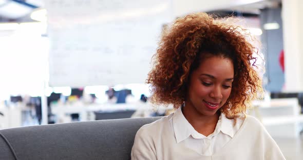 Businesswoman smiling in office alt